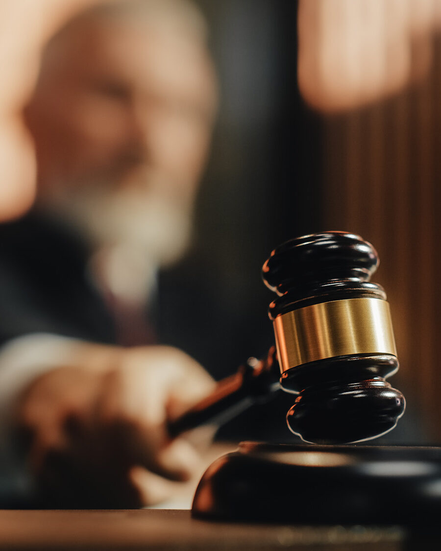 Court of Law and Justice Trial Session: Imparcial Honorable Judge Pronouncing Sentence, striking Gavel. Focus on Mallet, Hammer. Cinematic Shot of Dramatic Not Guilty Verdict. Close-up Shot.